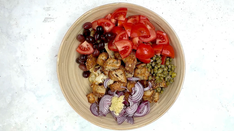 cauliflower, bread, onion, garlic, olives, tomatoes and capers