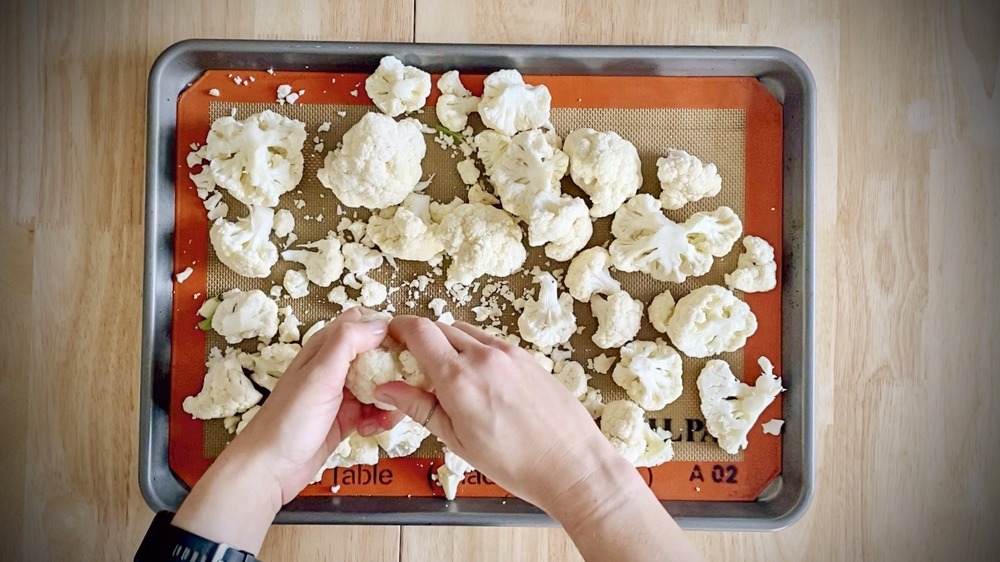 roasted cauliflower being pulled apart