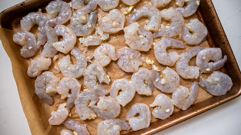 marinated shrimp on baking sheet