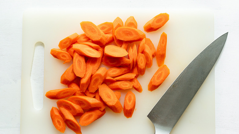 sliced carrots on cutting board