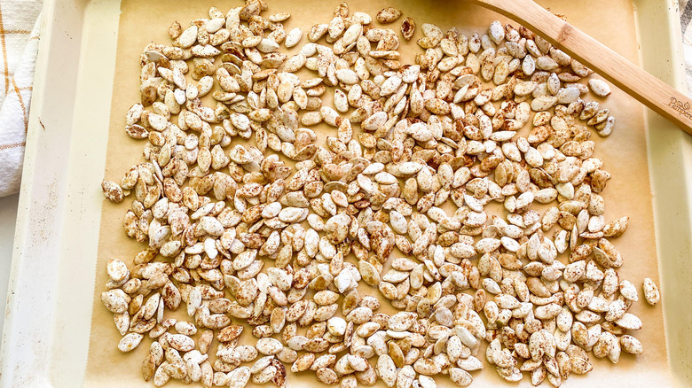 pumpkin seeds on baking sheet 