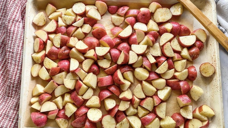 cubed potatoes on baking sheet