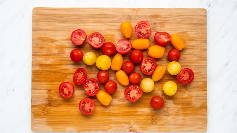 mulitcolored tomatoes on cutting board