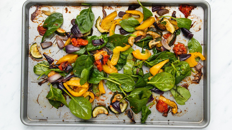 assorted vegetables on baking sheet