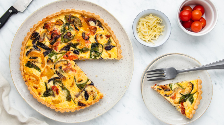 quiche and slice on plate