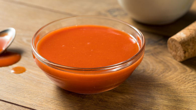 Small bowl of Buffalo sauce