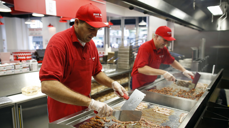 Five Guys workers making burgers