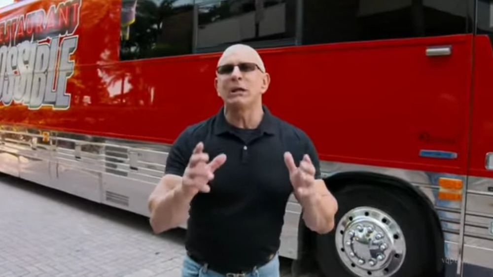 Robert Irvine in front of Restaurant: Impossible bus