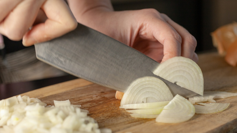 Onions sliced on a cutting board