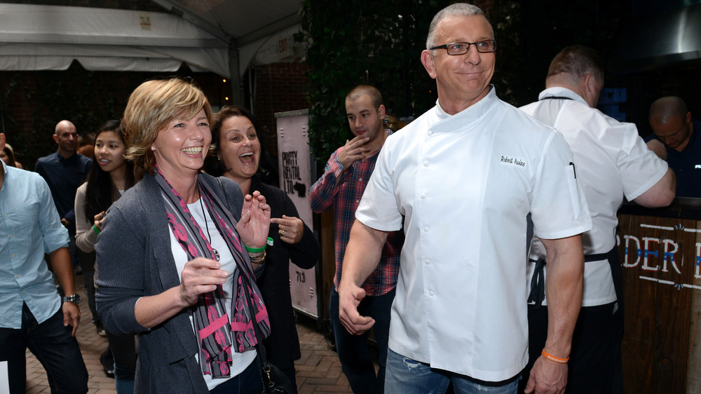 Robert Irvine smiling with group