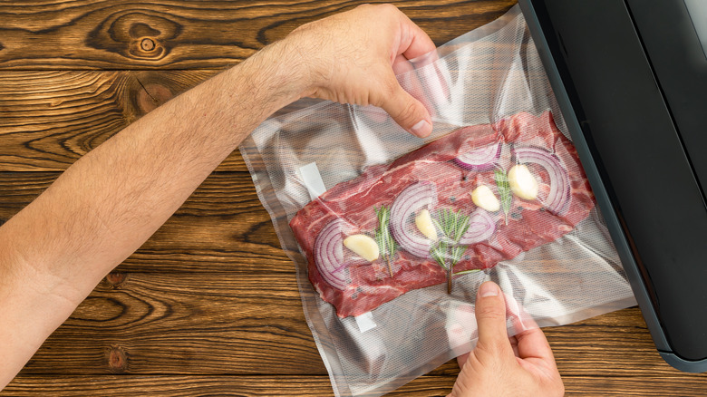 Person preparing sous-vide steak