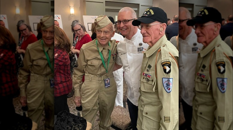 Robert Irvine poses with Pearl Harbor veterans