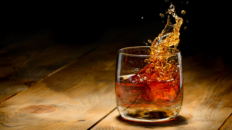 Whiskey sloshing in glass