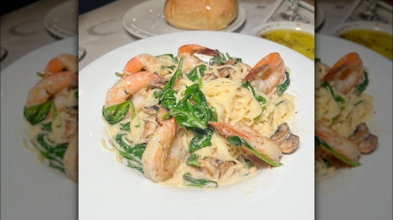 bowl of shrimp pasta with spinach