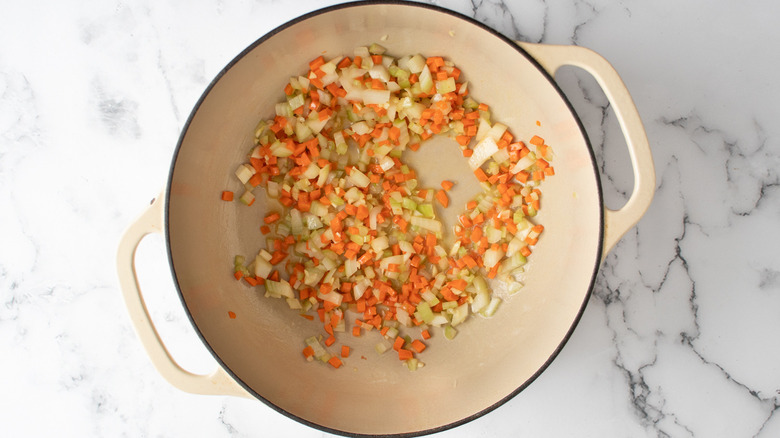 onion, celery, carrots,  and garlic sauteing