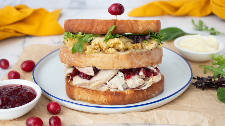 stacked thanksgiving leftover sandwich on plate