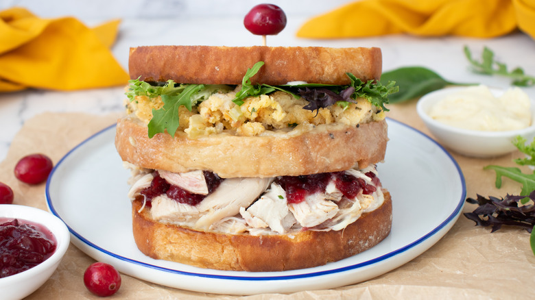 stacked turkey leftover thanksgiving sandwich on plate