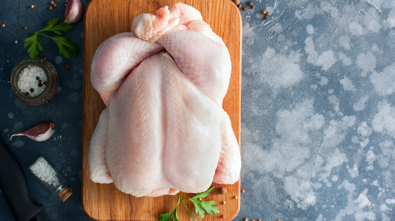 raw chicken on cutting board