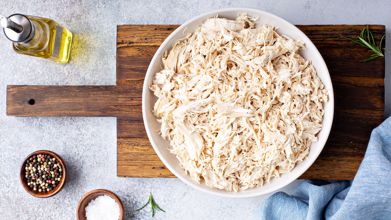 shredded chicken in white bowl