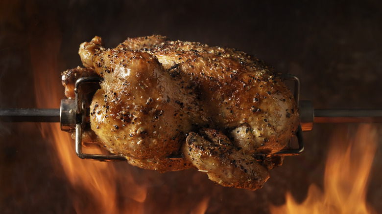 Chicken roasting on spit