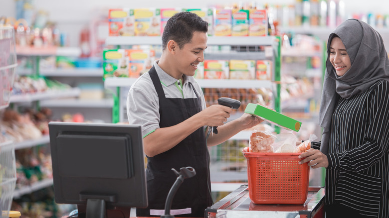 Cashier with barcode scanner