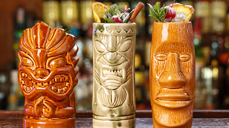 Tiki drinks in totem cocktail glasses