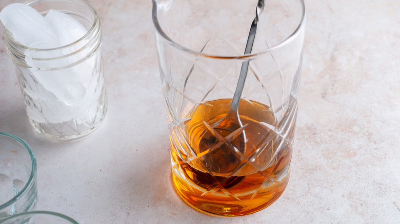 liquor in glass with spoon