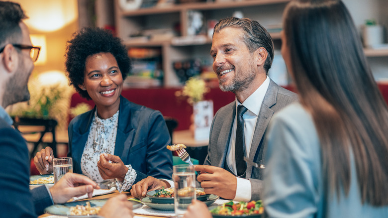 Friends having lunch in business casual attire