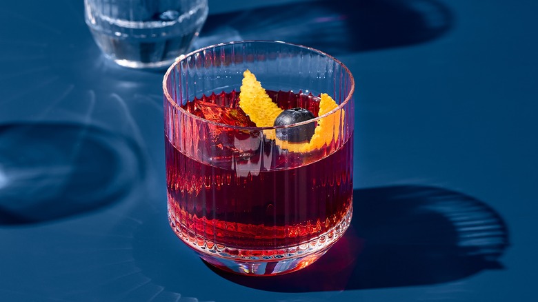 Negroni glass on blue background