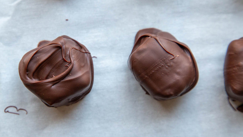 chocolate-covered brie cubes on sheet pan