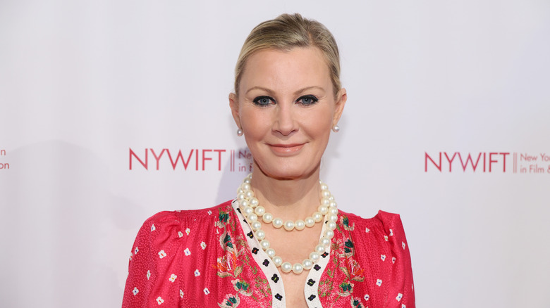 Sandra Lee smiling in front of white backdrop