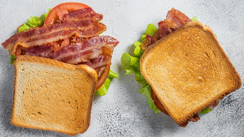 Bird's eye view of two BLT sandwiches on toasted bread