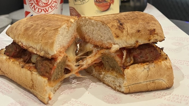 Sliced meatball sub with drink