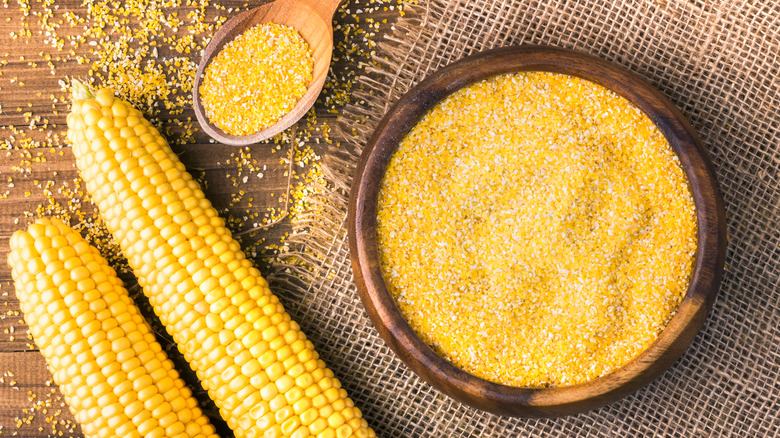 Grits in bowl and corn ears