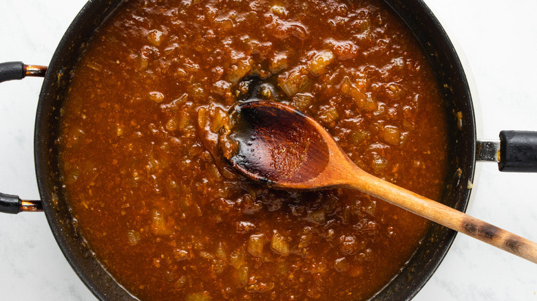apricot sauce with wooden spoon