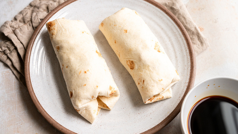 burritos on beige plate