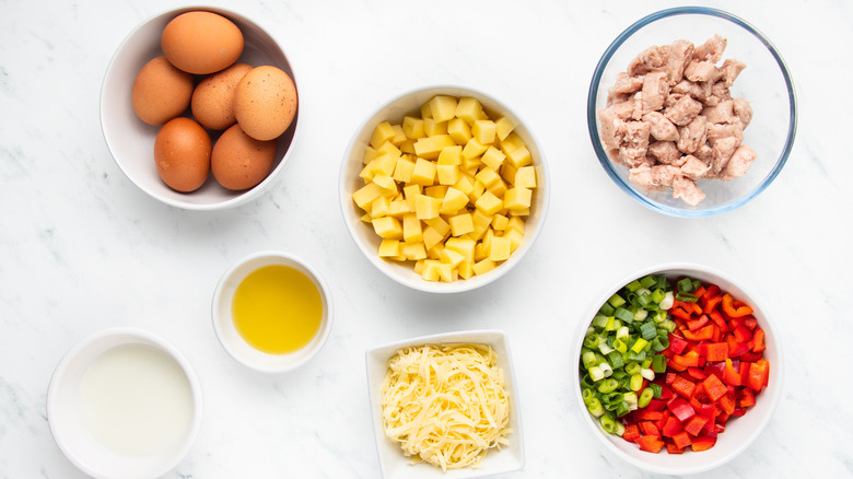 sausage and potato frittata ingredients in bowls