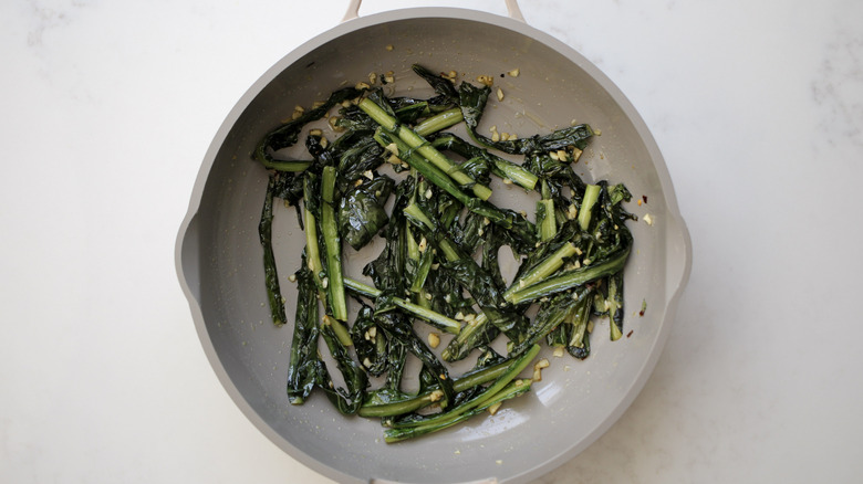 sauteing dandelion greens in pan