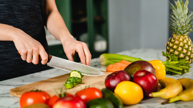 Woman cutting vegetables