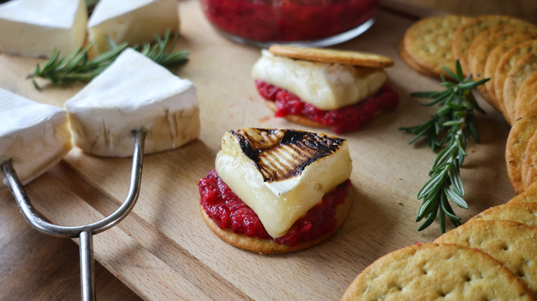 roasted brie on cracker with cranberry relish