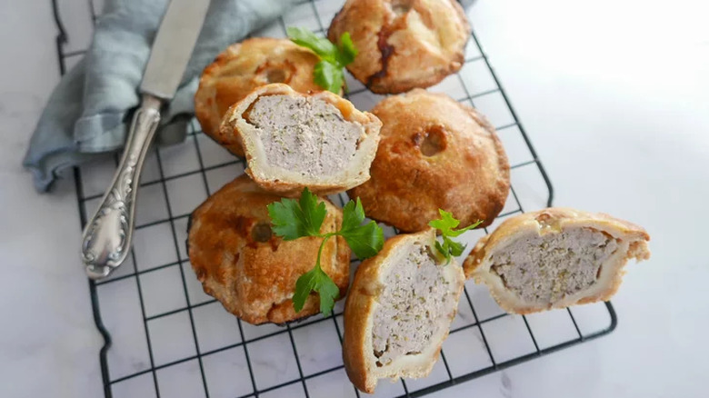 Mini meat pies inside deep brown crusts. 