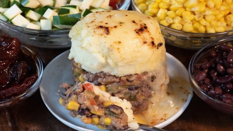 Ground beef with veggies topped with browned mashed potatoes.