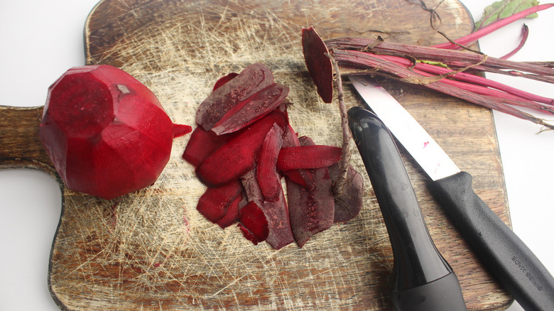 peeled beets on cutting board