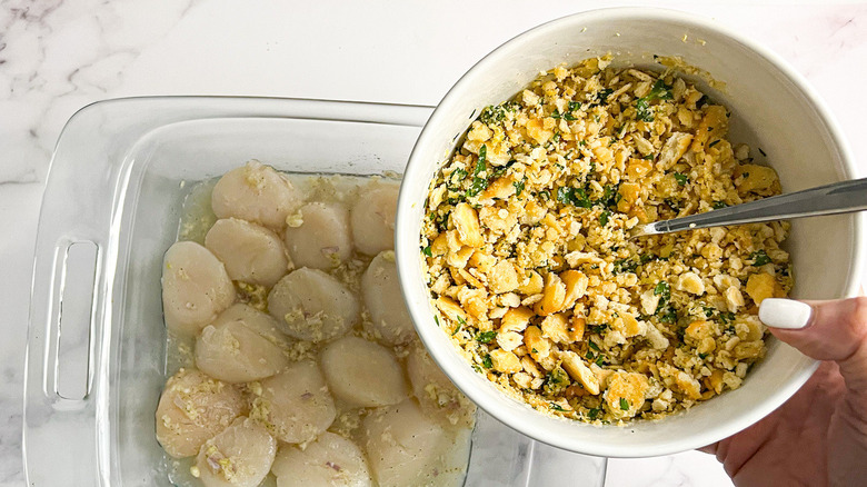 scallops in dish with bowl of cracker crumbs