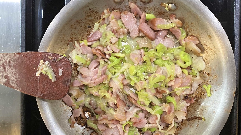 bacon and leeks in pan for scalloped potatoes