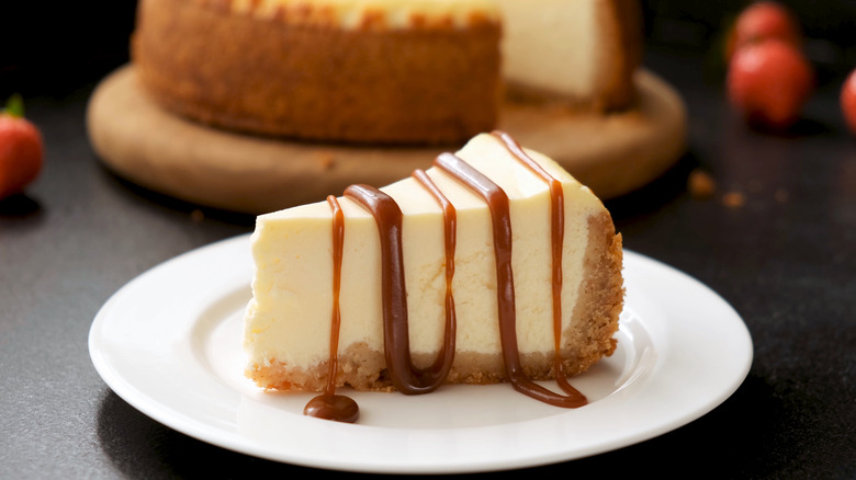 Slice of cheesecake with drizzled sauce