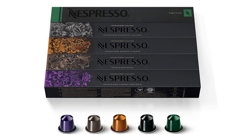 Black box of Nespresso capsules with capsules underneath.