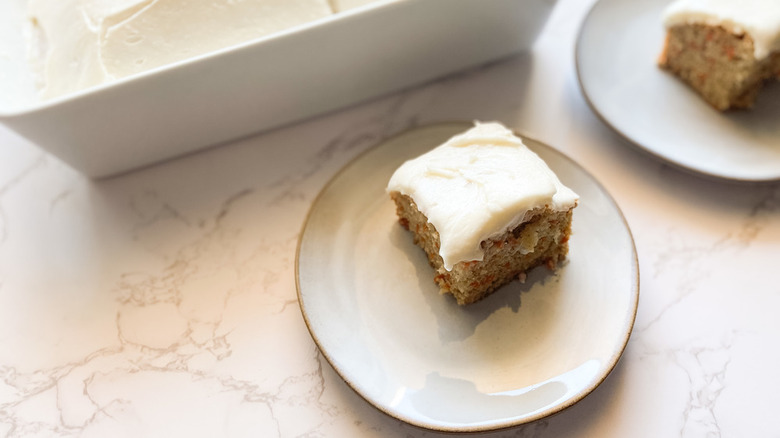 plate of frosted carrot cake