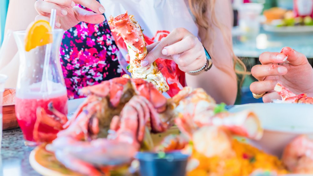 Woman eating lobster