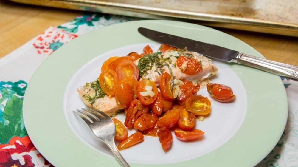 Herbed salmon en papillote with grape tomatoes